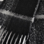 Radley's Fluffy Check Print Monochrome Scarf has a fringed edge that adds texture and is perfect for keeping warm during the Winter.