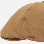 The BOSS logo on the Beige Trystan Techwool Flat Cap.