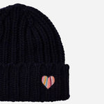 The swirl heart logo on the Women's Navy Blue Lambswool Beanie with Swirl Heart Logo.