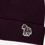 The striped zebra logo on the Men's Red Wool Beanie Hat with Striped Zebra Logo.