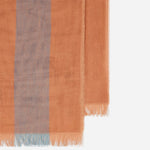 The frayed edges of the Paul Smith Women's Orange Stripe Cotton Scarf with Large Logo.