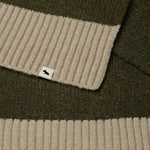 Contrasting ends and Scottie dog mascot tag on the Knitters Lane Pine Needle Scarf with Contrasting Ends.