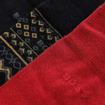 Close up of the 3 Pairs of Socks Winter Gift Set in Red, Black, and Fair Isle.