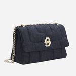 Side view of the Denim Quilted Shoulder Bag with Double 'B' Monogram.