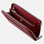 Inside the Pockets Carmine Leather Large Zip Around Wallet.