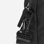 Side view of the Stormy Black Faux Leather Reporter Bag with BOSS Logo.
