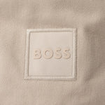 Close up of the logo on the Febas Beige Cotton Bucket Hat with Logo.