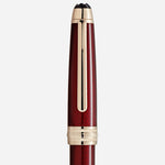 The cap and clip of the Burgundy Red Meisterstück Solitaire Golden Hour Midsize Ballpoint Pen.