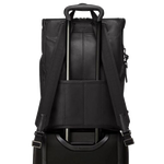 TUMI's Harrison Black Bombe Osborn Roll Top Backpack has the add-a-bag strap that can be attached to luggage handles so it's easy to travel with.