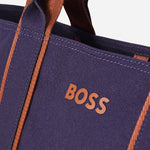 The BOSS logo on the Navy Blue and Copper Palmah Tote with Logo Straps.