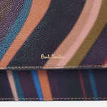 The Paul Smith signature embossed in gold foil on the Women's Swirl Print Leather Evening Bag with Chain Strap.