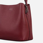 Side view of the Dukes Place Carmine Red Leather Medium Compartment Cross Body Bag.