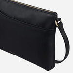 Side view of the Pockets Black Medium Zip Top Cross Body Bag.
