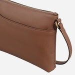 Side view of the Pockets Saddle Brown Medium Zip Top Cross Body Bag.