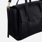 Side view of The Chancery Black Medium Flapover Multiway Bag.
