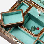 The lower compartment inside the Sleeping Beauty Ballet Musical Jewellery Box in Turquoise and Walnut Wood.