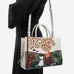 The adjustable and removable cross body strap on the Autumn Leaves Snow Medium Zip Top Multiway Bag.