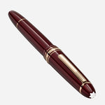 The snowcap emblem at the crown of the Meisterstück Burgundy Red LeGrand Rollerball Pen.