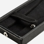The press-stud and tab that secure the watch inside the Philipp Black Faux Leather Flip Watch Stand.