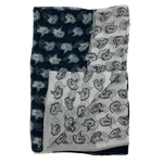 This Paul Smith scarf is made from a silk material in a floral black and white pattern.