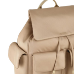 The outside of the Guildford Grove Medium Stone Flapover Backpack features four patch pockets and the Radley logo in gold metal lettering.