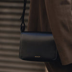 The Westwell Lane Black Small Flapover Cross Body Bag by Radley.