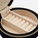 The ring rolls and compartments inside the Zoe Indigo Velvet Travel Round Jewellery Case.