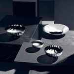 Georg Jensen's Stainless Steel Bernadotte Medium Bowl looks great on a table when serving multiple dishes.