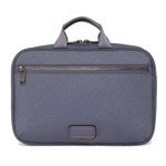 This TUMI Voyageur Blue Shimmer Madeline Cosmetic Case is made out of nylon with leather trims.