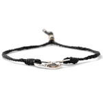 This Men's Black Oval Link Bracelet comes with a polyester cord and engraved Paul Smith silver charm and bead.