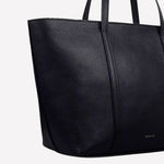 The Radley brand name has been embossed into the leather of this Tote Bag at the bottom.