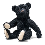 This Steiff Replica 1912 RMS Black Teddy Bear is made out of a mohair and cotton blend with wooden shavings for the stuffing to either keep the bear sitting or standing.