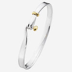 This is the Georg Jensen Sterling Silver & 18 KT. Yellow Gold Torun Bangle.