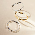 This Georg Jensen Torun Sterling Silver Bangle has white diamonds to add a glam touch.