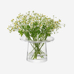 LSA's Victoria Lantern Clear Glass Vase 13.5 cm looks great on a table with small stems of flowers for a simple finish.
