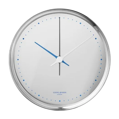 Georg Jensen's Koppel White Stainless Steel Wall Clock 22cm has blue detailing that stands out against the white