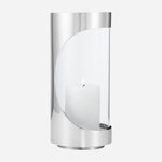 The Chrome Contours Small Stainless Steel and Glass Hurricane Candleholder by Georg Jensen.