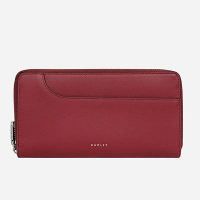The Pockets Carmine Leather Large Zip Around Wallet by Radley.