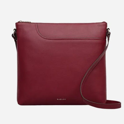 The Pockets Carmine Red Leather Large Zip Top NS Cross Body Bag by Radley.