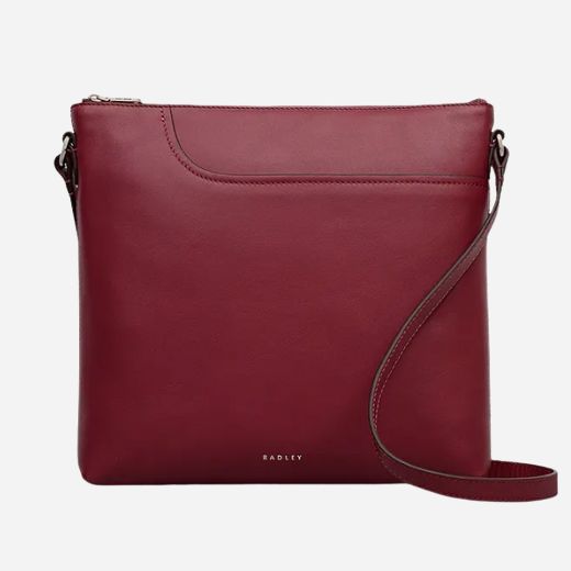 The Pockets Carmine Red Leather Large Zip Top NS Cross Body Bag by Radley.