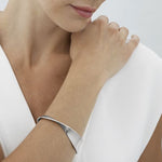 Georg Jensen's Sterling Silver Moebius Bangle makes a lovely gift for her and will come in a GJ gift box at the time of purchase.