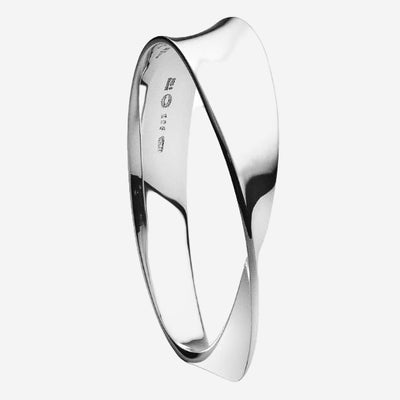 This Georg Jensen Sterling Silver Moebius Bangle is made from sterling silver and has a twist design.