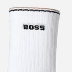The BOSS logo and three-stripe detailing on the BOSS 3-Pack of Quarter-Length Cotton-Blend White Socks with Three-Stripe Edges.