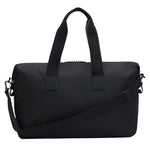 Back view of the Catch 3.0 Black Polyester Holdall with Signature Stripe Handles.