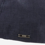 Close up of the BOSS logo on the side of the BOSS Trystan Navy Blue Linen Flat Cap.