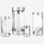 The Chrome Contours collection, including the Chrome Contours Medium Stainless Steel and Glass Hurricane Candleholder.