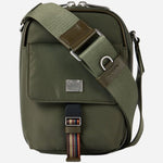 The cross body strap on the Paul Smith Green Recycled Nylon Small Flight Bag with Signature Stripe Trims.