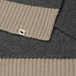 Contrasting ends and Scottie dog mascot tag on the Knitters Lane Dark Grey Scarf with Contrasting Ends.