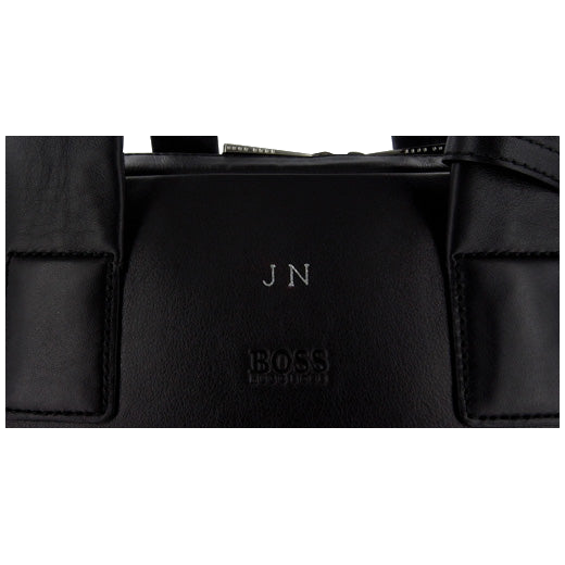 Leather embossing onto a HugoBoss Bag.