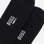 The BOSS logos on the BOSS 2-Pack Ankle Length Black Cotton Blend Socks.